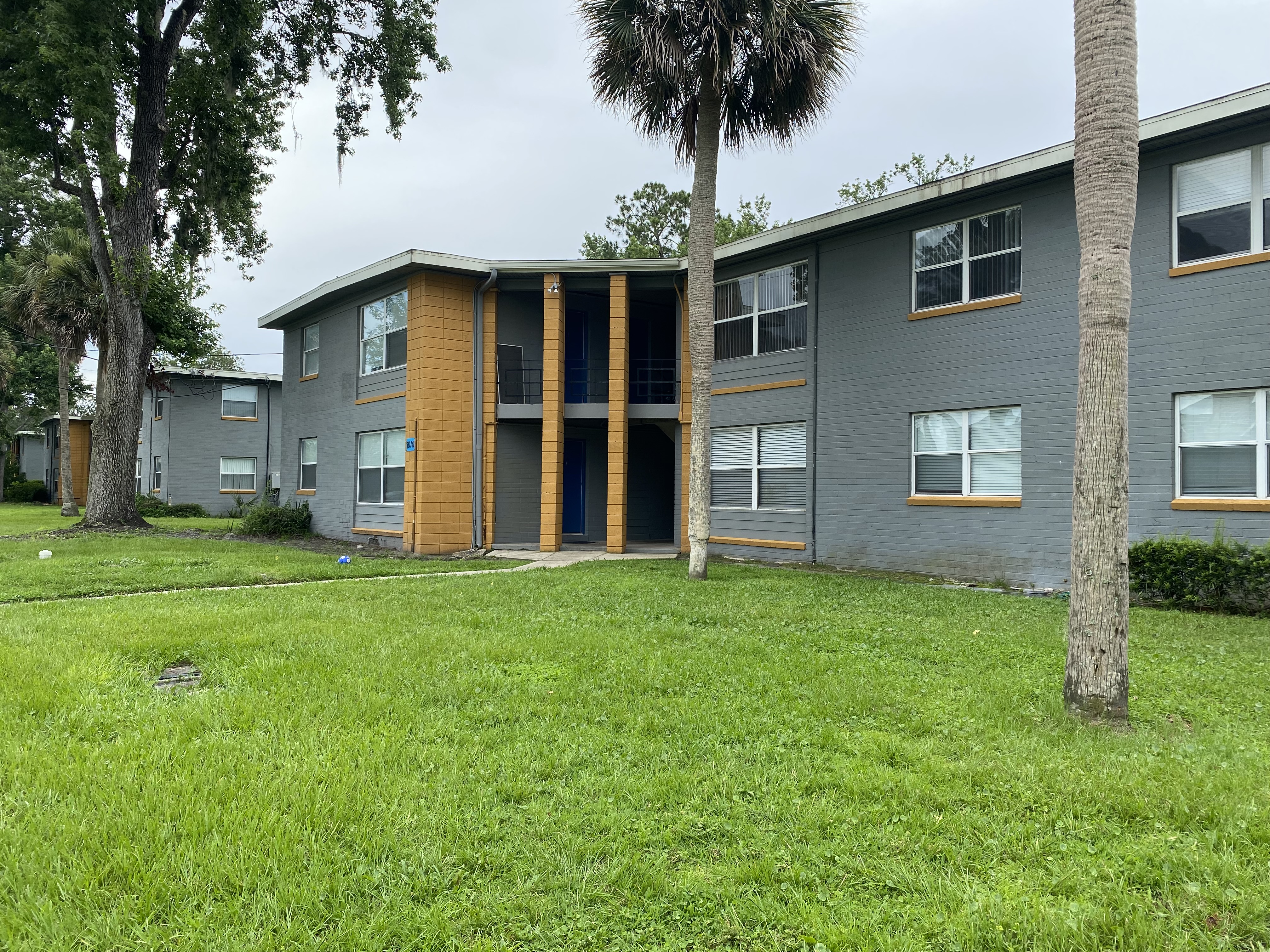 Apartment Building with Palm Trees
